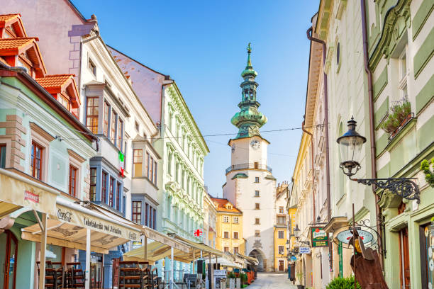 Stock photograph of an alley with stores and restaurants in old town Bratislava, Slovakia.